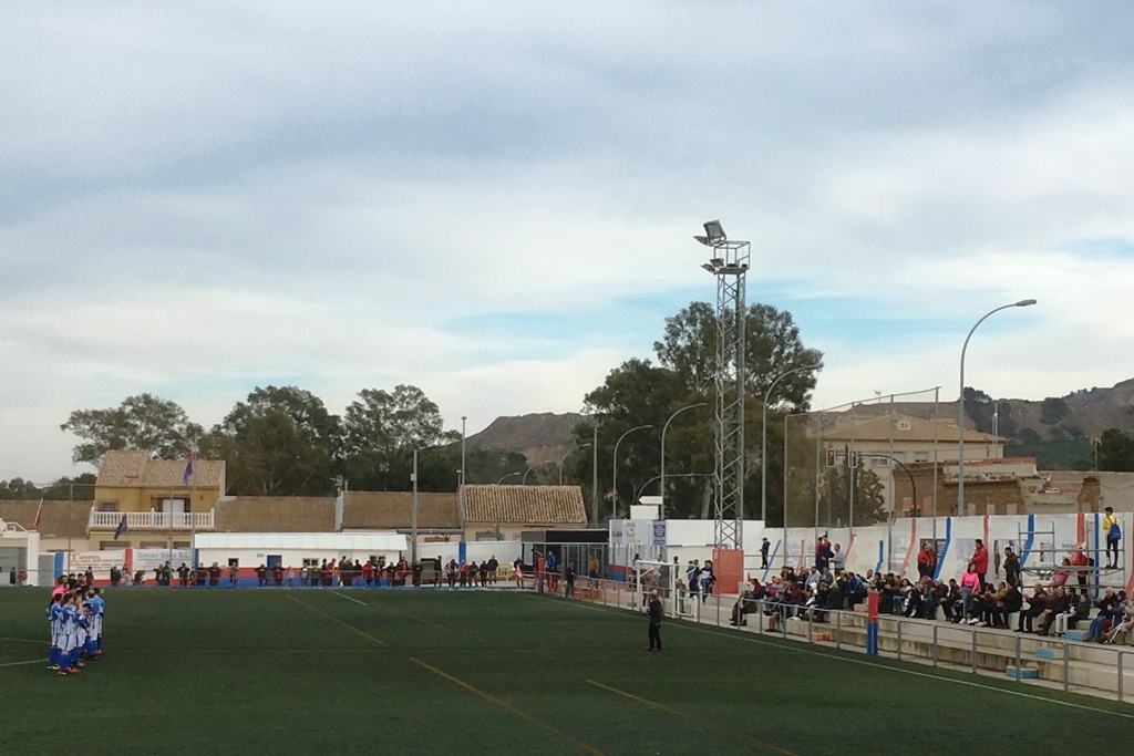 Players from Deportiva Minera and Aguilas line up before kick-off